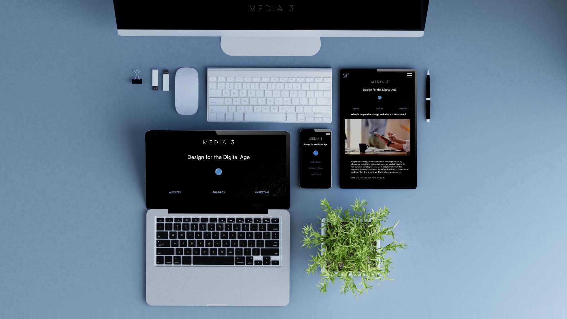 Desk with computer. laptop, tablet, and mobile phone on the same website created with responsive design.